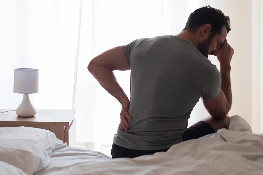 man suffering pain from hernia mesh